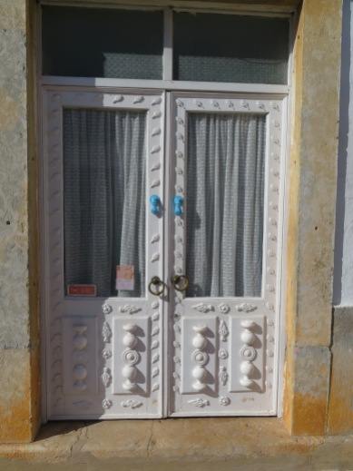 Happy door with wonderful whimsical door knockers