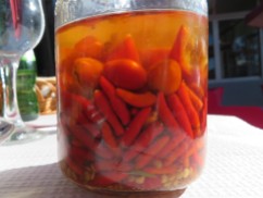 I loved this. It is the woman's homemade piripiri sauce......several types of peppers, garlic and all marinated in whiskey!!!! She warned me to use only a little which I did and what incredible flavour.