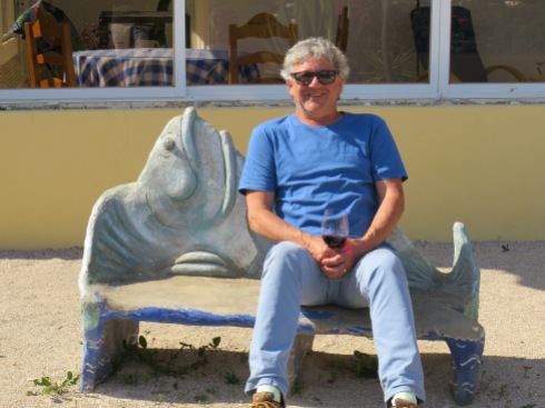 My happy husband enjoying a glass of vino, the first in quite some time, on the fish motif bench in Pat and Gary's garden.